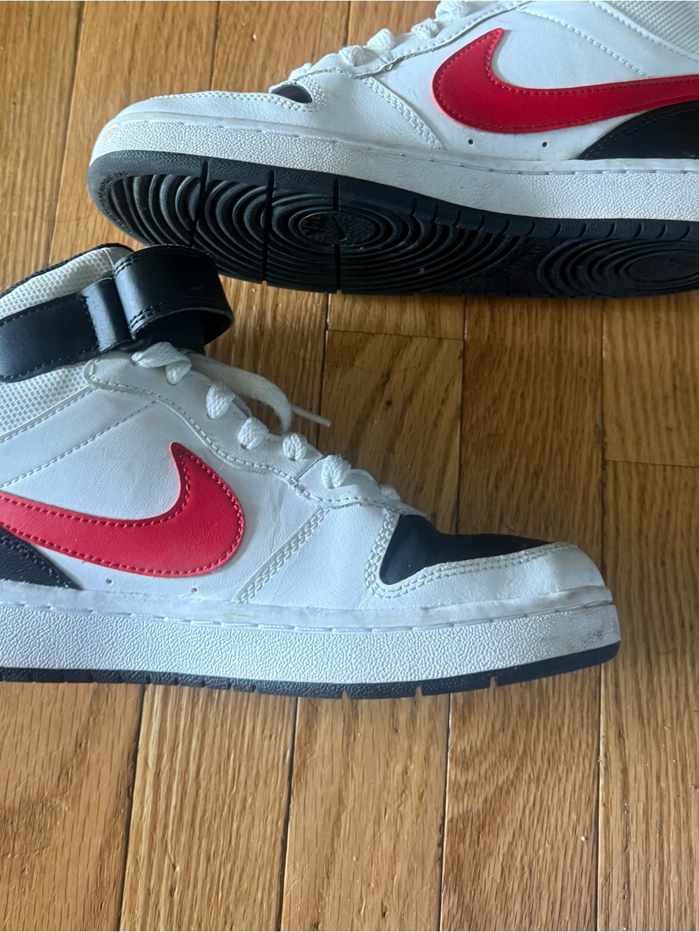 Nike Kids White Sneakers with Red Swoosh and Black Details
